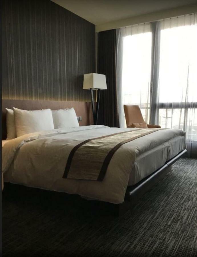 Hotel In Pingzhen Bagian luar foto